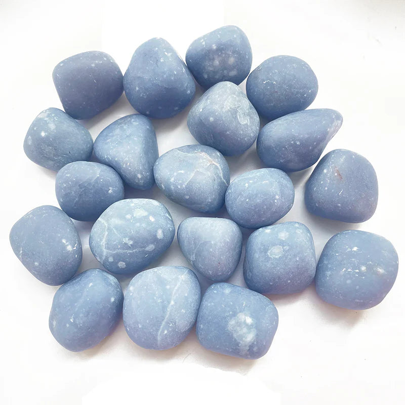 Sky blue angelite tumblestones dappled with cloudy white veins and patches.