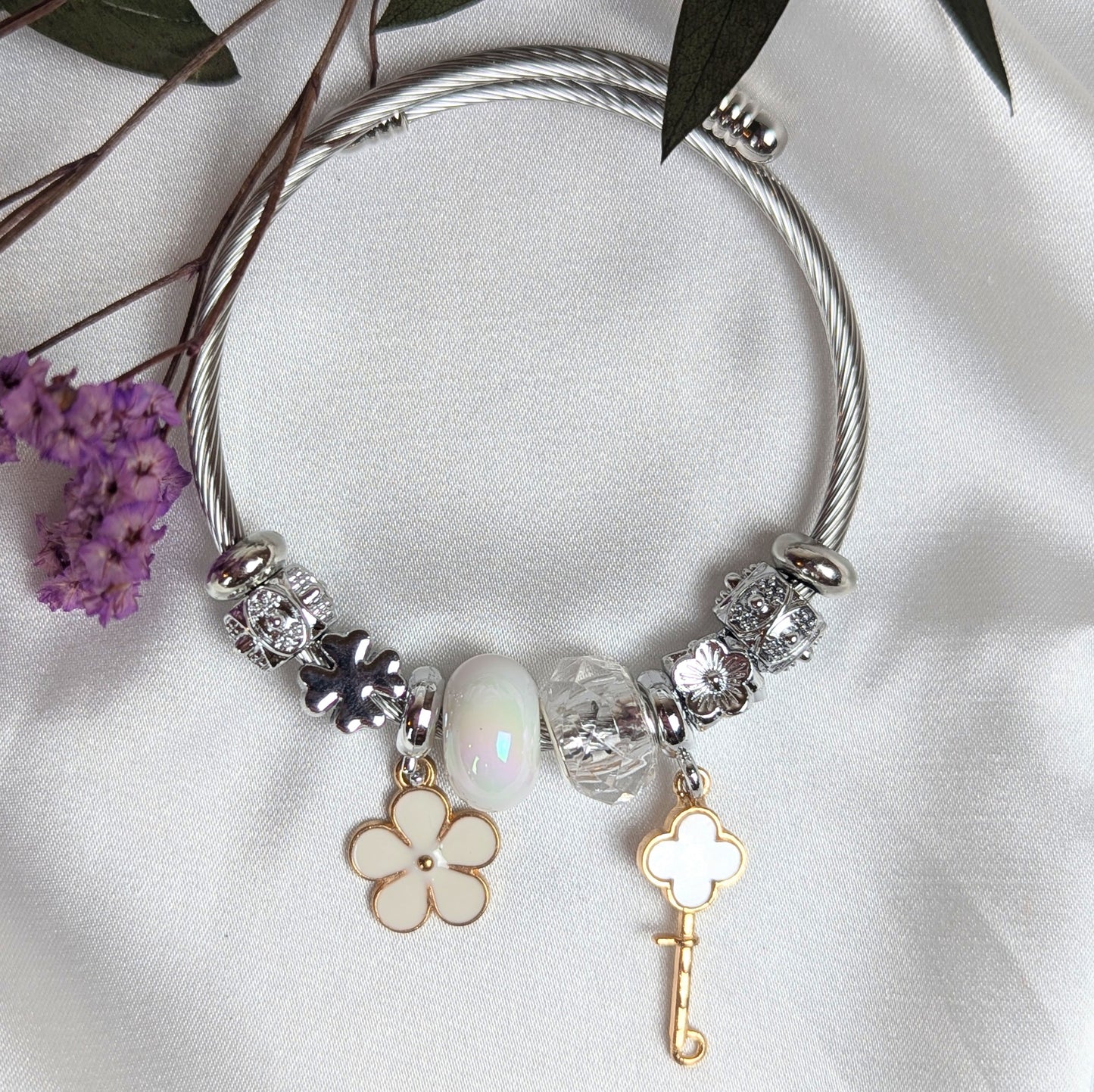 White Key and Clover Charm Bracelet