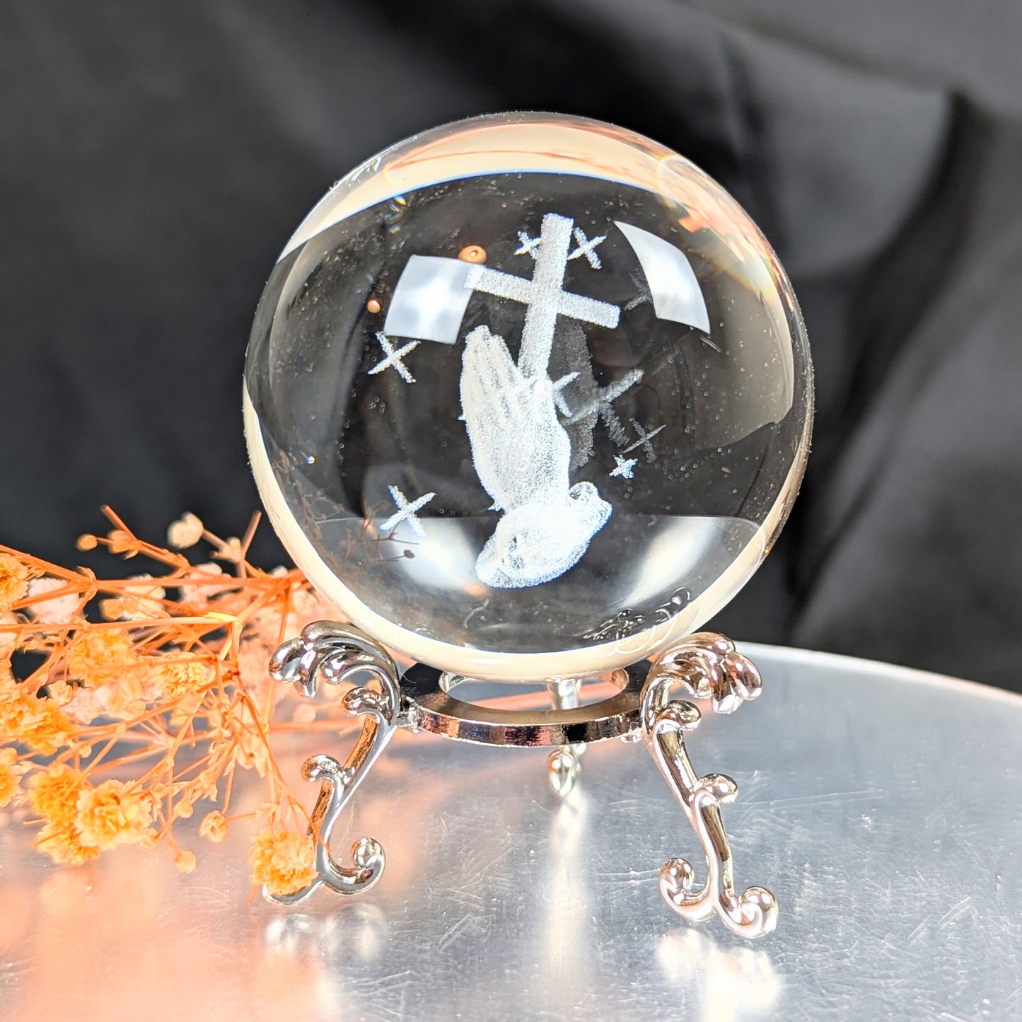 Praying Hands in Glass Sphere