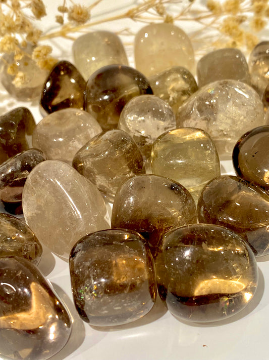 Several smoky quartz tumbled stone crystals.
