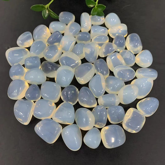 Translucent white opalite tumbled stones.