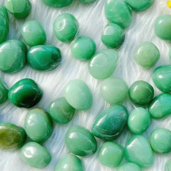 Green aventurine tumblestones in pearly shades from sage to forest green.