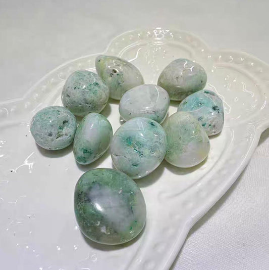 Phoenix stone crystal tumblestones in milky white with shades of sea green.