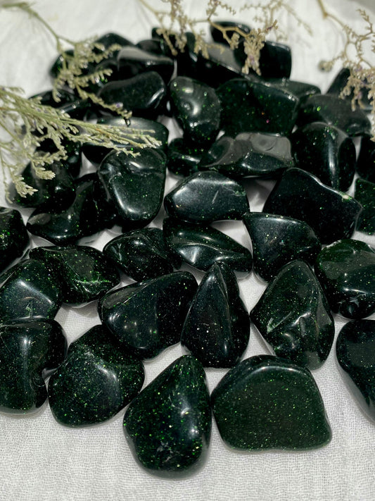 Tumbled goldstones in pine green with light green flecks.